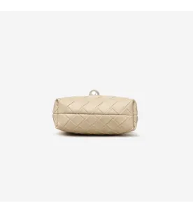 Beige woven leather clutch bag detail showing exquisite craftsmanship and pearl closure.