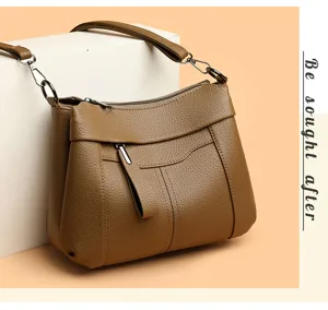 Brown leather shoulder bag for women, stylish crossbody handbag with durable hardware and style.