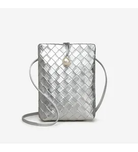 Detailed view of silver woven mini crossbody phone bag featuring elegant pearl closure design.