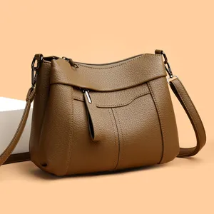 Elegant brown leather women crossbody bag, fashionable mother shoulder bag for daily wear.