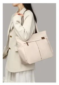 Minimalist beige tote shoulder bag for women, stylish large capacity commuter office bag.