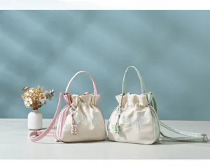 Chinese style embroidered bucket bag for women, versatile casual tote and crossbody handbag.