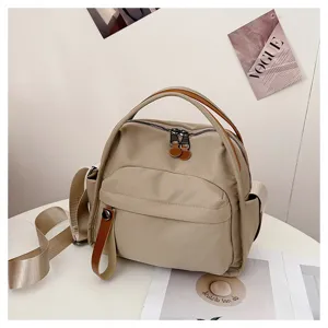 Minimalist large capacity commuting canvas shoulder backpack, stylish and versatile casual bag.