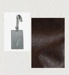 Detailed view of soft leather tote bag with card holder accessory and texture swatch.