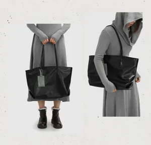Close-up detail view of the large capacity soft leather tote bag showcasing its versatile design.
