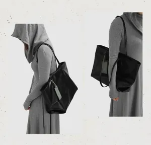 Large capacity black soft leather tote bag for women, elegant commuter shoulder bag.