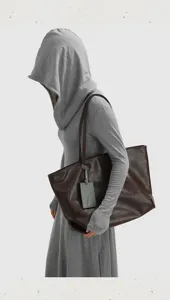 Large capacity soft leather tote bag for women, stylish commuting shoulder bag daily use.