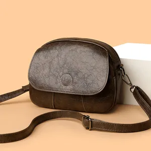 Borsa a tracolla in pelle marrone vintage da donna, mini borsa rotonda elegante con patta.
