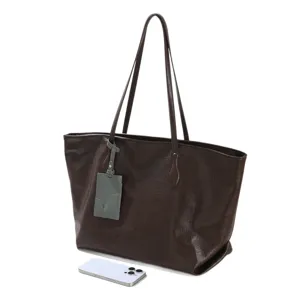 Women's large capacity soft leather tote bag, stylish commuting shoulder bag for daily use.