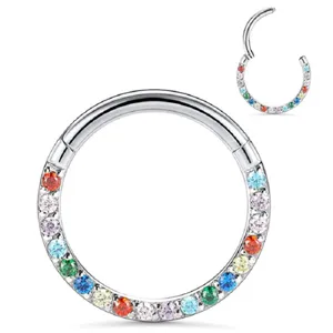 Detailed view of a titanium hinged segment ring with multi-color cubic zirconia for body piercing.