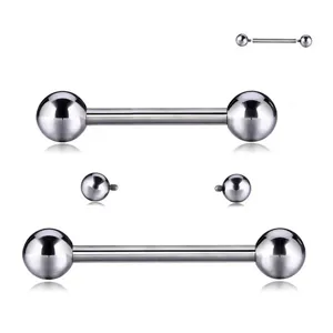 Gros plan sur les composants de piercing en alliage de titane G23, barre et billes.