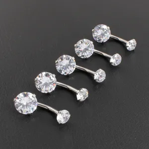 Detailed view of 316L stainless steel curved belly button rings with sparkling cubic zirconia.