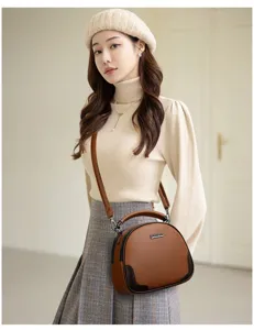 Stilvolle Damen braune Leder Umhängetasche Detailansicht, elegante Handtasche für den Alltag.