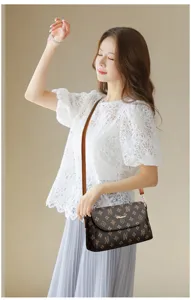 Elegant brown monogram crossbody bag for women, stylish vintage shoulder bag with fine strap.
