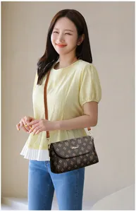 Stylish brown monogram shoulder bag for women, classic design crossbody daily handbag.