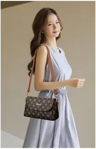 Stylish women brown monogram shoulder bag, elegant crossbody bag for daily use and travel.
