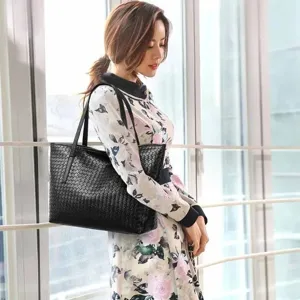 Elegant black woven leather tote bag for women, large capacity stylish shoulder bag.