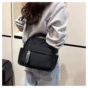 Minimalist black nylon crossbody bag, versatile commute shoulder handbag with roomy capacity.