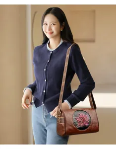 Vintage Chinese style leather crossbody bag for women, retro lotus embossed shoulder bag.