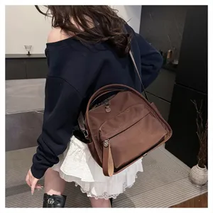 Detail shot of the stylish brown nylon casual backpack showcasing its daily commuting design.