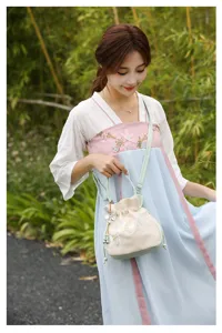 Detailed view of the neo-Chinese embroidered handbag, elegant floral embroidery and chic style.