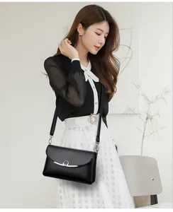 Elegant black leather shoulder bag for women, stylish crossbody messenger bag detail view.