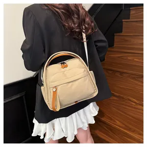 Casual canvas crossbody bag with large capacity, stylish commuter shoulder handbag in khaki.