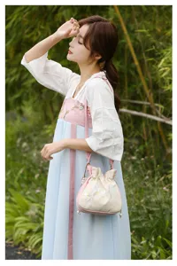 Detailed view of the new Chinese style embroidered shoulder bag, showcasing fine floral craftsmanship.