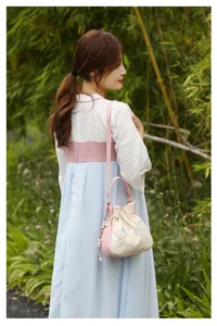 Elegant Chinese style embroidered women shoulder bag, casual bucket handbag for daily commute.