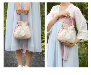 Chinese style embroidered bucket bag, casual shoulder handbag with delicate floral patterns.