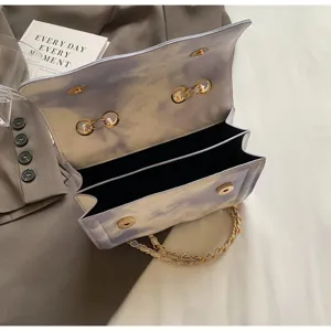 Detailed view of the stylish cloud pattern shoulder chain bag with magnetic locks for women.