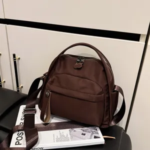 Stylish brown lightweight crossbody bag, versatile large capacity commuter shoulder handbag for women.