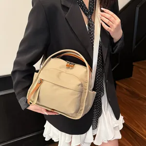 Minimalist lightweight nylon crossbody bag for women, versatile large capacity commute handbag.