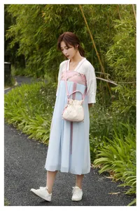 Detailed view of the Chinese style embroidered shoulder bag with cute drawstring bucket design.