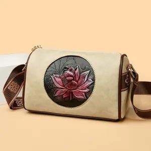 Retro lotus embossed barrel shoulder bag, elegant casual crossbody bag for women daily commute.