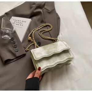 Detailed view of the trendy wave pattern chain shoulder bag, stylish light luxury crossbody design.