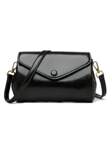 Stylish black PU leather crossbody bag for women, vintage shoulder bag with retro design.