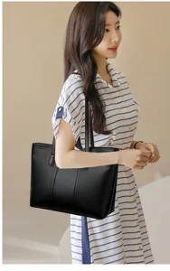 Stylish black leather tote bag for women, large capacity shoulder bag for daily use.
