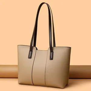 Elegant women's leather tote bag with double shoulder straps, large capacity for daily commute.