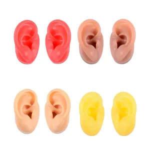 Silicone ear models for piercing tattoo practice, soft flexible display ears in assorted colors.