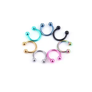 Detailed shot of multi-color 316L stainless steel horseshoe piercing rings with round balls.