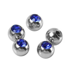 Stainless steel threaded piercing replacement balls with blue crystal for body jewelry.