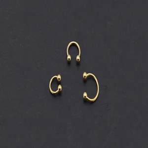 Gold stainless steel horseshoe rings set, C-shaped circular barbells for body piercing.
