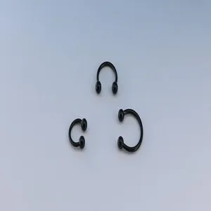 Black stainless steel horseshoe ring piercing jewelry, C-shaped body piercing rings display.