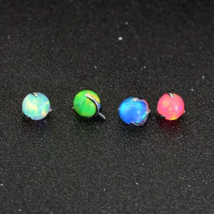 Closeup view of G23 titanium opal piercing ball accessories in four vibrant colors.