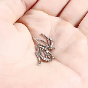 Stainless steel curved barbell detail shot, external thread body piercing jewelry part.