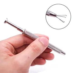 Close-up detail of the four-prong diamond pickup tool tip and anti-slip handle design.