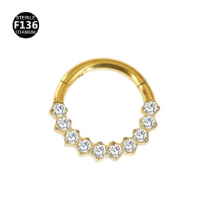 Gold titanium piercing jewelry with crystal crown detail, ideal for cartilage and septum.