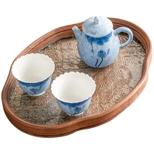 Hand-painted blue lotus ceramic kung fu tea set with one teapot and two cups on wooden tray.