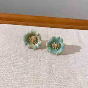 Charming green gradient flower stud earrings with delicate gold stamens for daily wear.